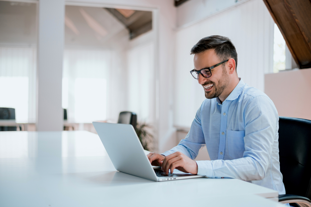 Event planner organizing an event on laptop